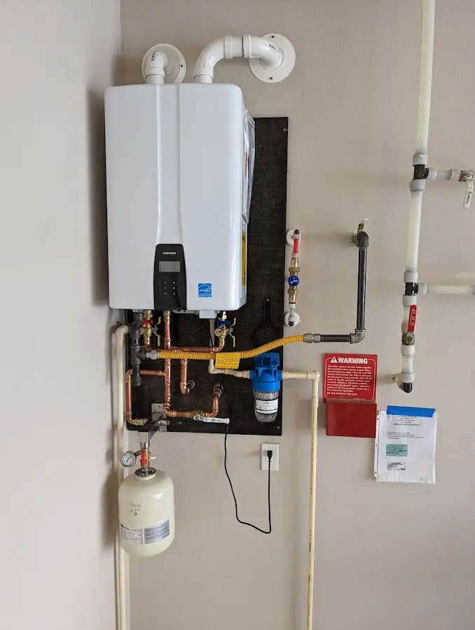 Professional plumber installing copper piping in a Monterey Park home